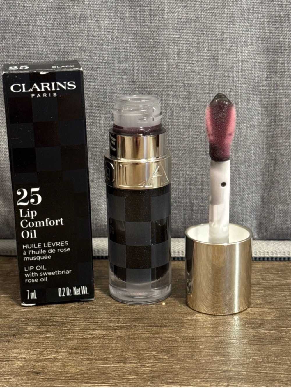 Clarins Lip Comfort Oil 25 in Black. 0.2 oz. NIB pH reactive